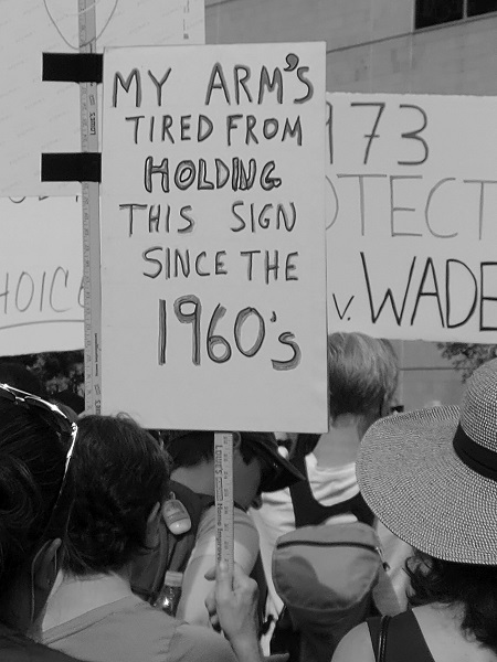holding-sign-since-60s
